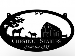 Metal sign with goat, horse and barn