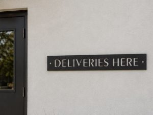 Metal DELIVERIES sign